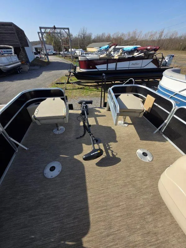 Slide: The Image of 2018 Misty Harbor 2085 Adventure CF pontoon boat with seating and trolling motor, docked outdoors. - 11