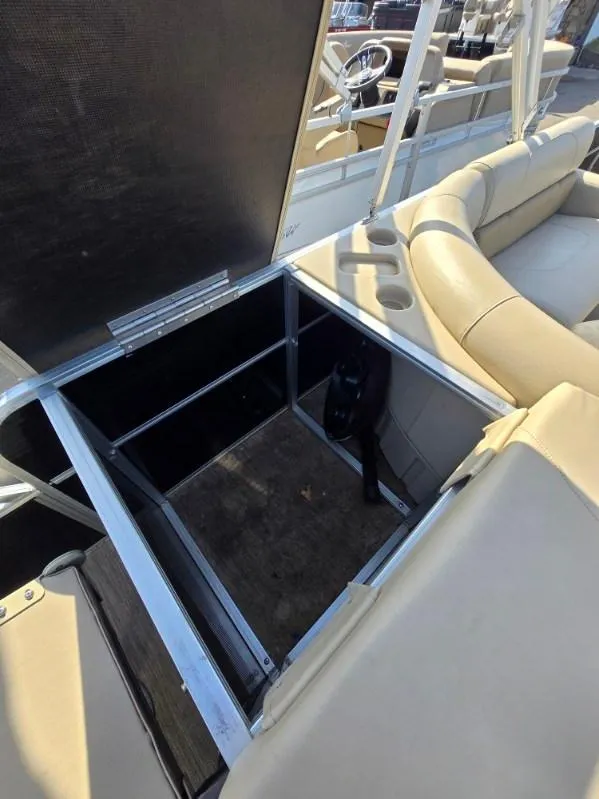 Slide: The Image of 2018 Misty Harbor 2085 Adventure CF boat with open storage compartment and beige seating. - 13