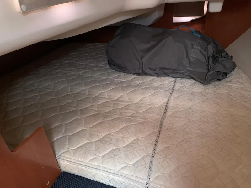 Slide: The Image of Interior cabin of 2010 Beneteau Oceanis 31 sailboat with mattress and bag. - 24
