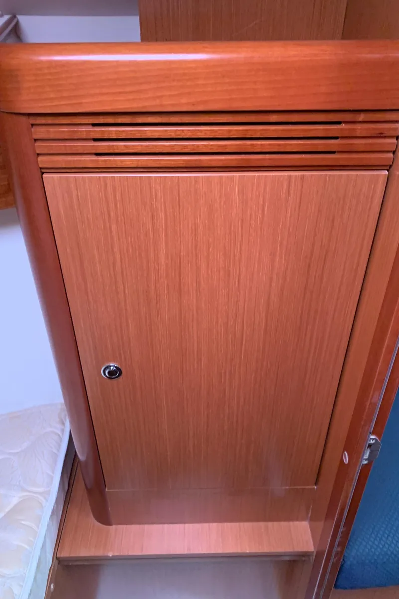 Slide: The Image of Wooden cabinet door inside 2010 Beneteau Oceanis 31 sailboat interior. - 25