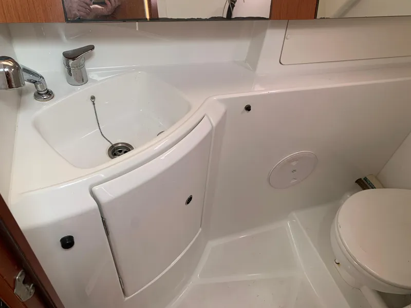 Slide: The Image of Beneteau Oceanis 31 2010 yacht bathroom with sink and toilet. - 29