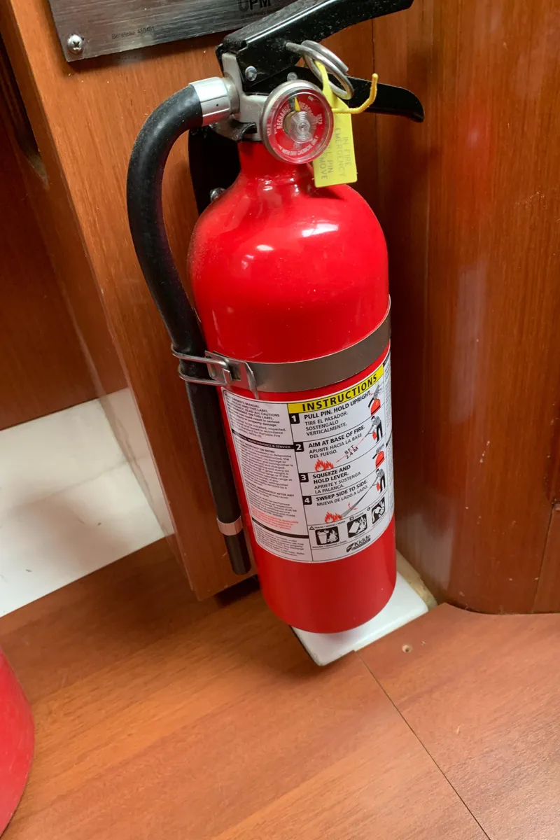 Slide: The Image of Red fire extinguisher mounted on a Beneteau Oceanis 31 yacht, 2010 model. - 37