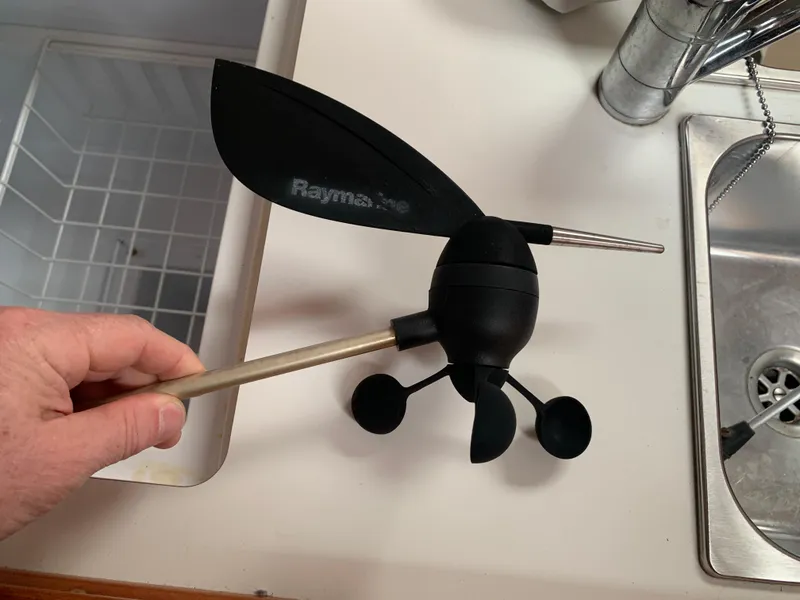 Slide: The Image of Hand holding a Raymarine wind vane sensor, suitable for a 2010 Beneteau Oceanis 31 yacht. - 44