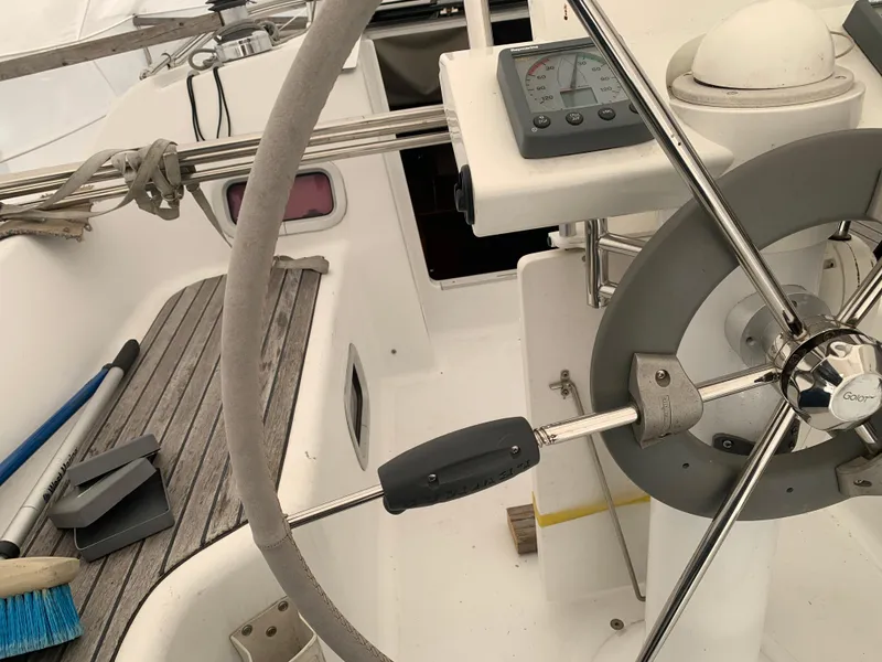 Slide: The Image of Cockpit of 2010 Beneteau Oceanis 31 sailboat with steering wheel and navigation instruments. - 46
