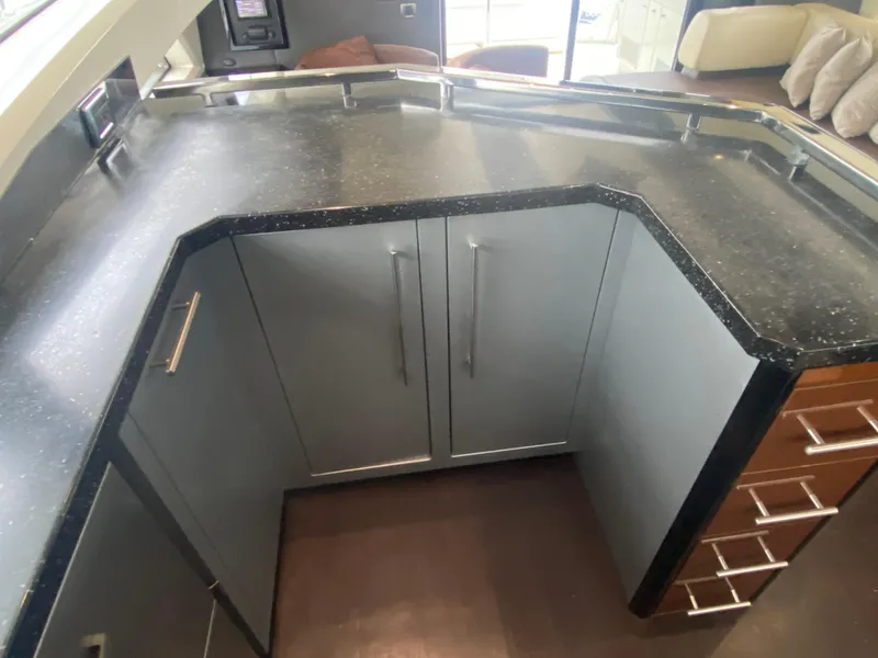 Slide: The Image of Modern kitchen area in a 2010 Marquis 500 Sport Bridge yacht. - 11