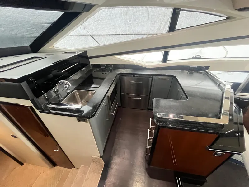 Slide: The Image of Interior of 2010 Marquis 500 Sport Bridge yacht with modern kitchen design. - 23