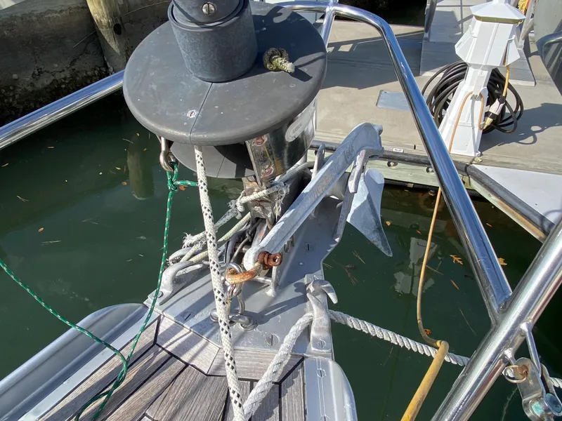 Slide: The Image of Bow of 1973 Nautor Swan 44 sailboat with anchor and ropes in marina. - 11