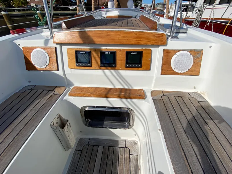 Slide: The Image of Cockpit of 1973 Nautor Swan 44 sailboat with wooden accents and navigation instruments. - 13
