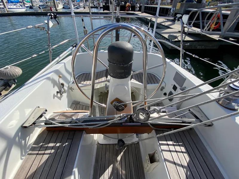 Slide: The Image of Cockpit of 1973 Nautor Swan 44 sailboat with steering wheel and rigging. - 14