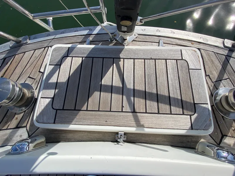 Slide: The Image of Deck of 1973 Nautor Swan 44 sailboat with wooden finish and metal fittings. - 16