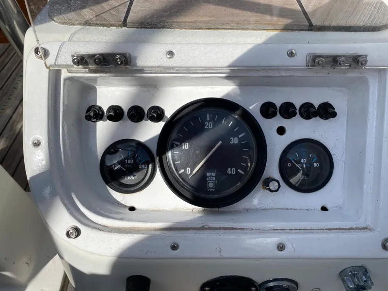 Slide: The Image of Control panel of a 1973 Nautor Swan 44 sailboat, featuring gauges and dials. - 19