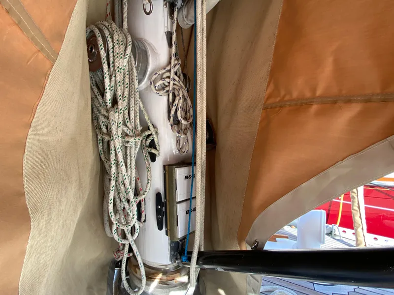 Slide: The Image of Interior view of a 1973 Nautor Swan 44 sailboat, featuring ropes and mast details. - 24