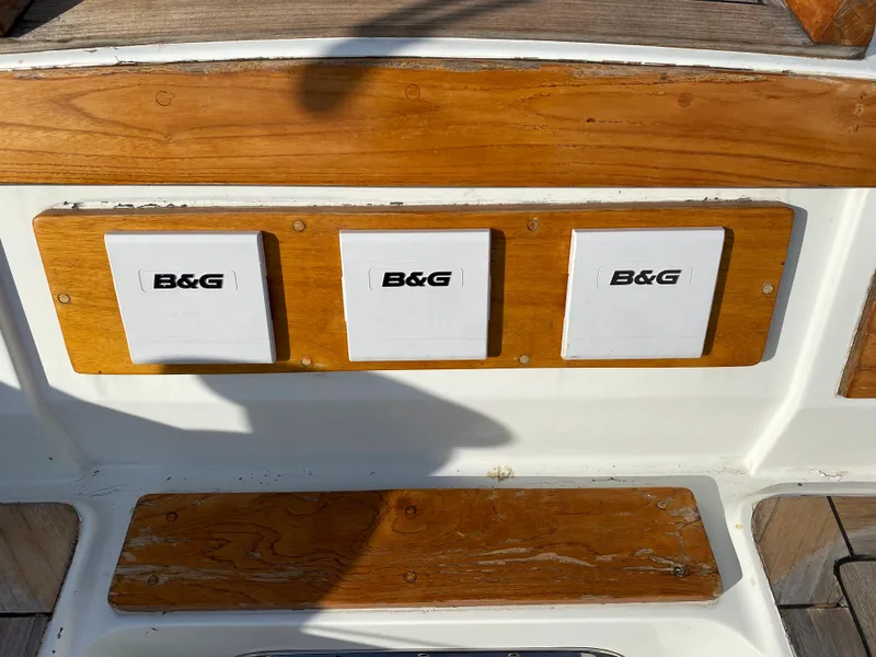 Slide: The Image of B&G instruments on 1973 Nautor Swan 44 yacht, featuring wooden paneling. - 26