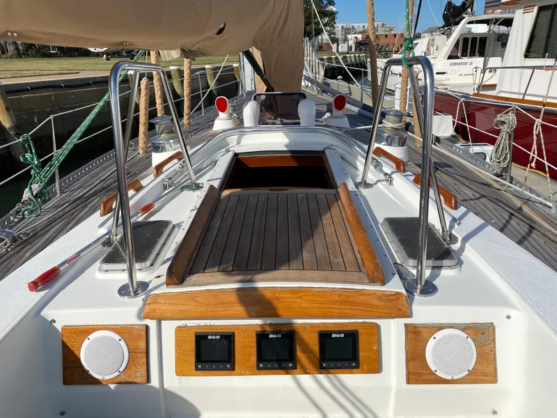 Slide: The Image of 1973 Nautor Swan 44 sailboat cockpit with wood accents and navigation instruments. - 27