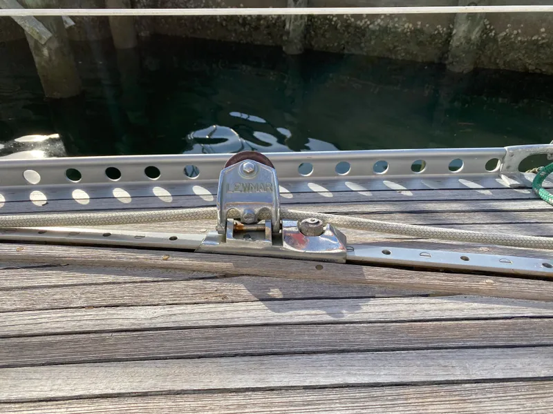 Slide: The Image of Deck detail of a 1973 Nautor Swan 44 sailboat, featuring a Lewmar track system. - 30