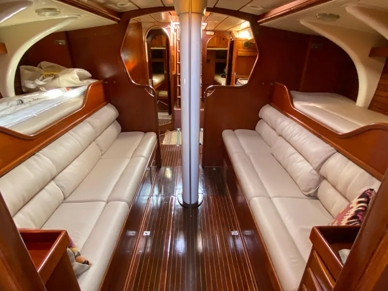 Slide: The Image of Interior of 1973 Nautor Swan 44 yacht with elegant wood finish and cozy seating. - 35