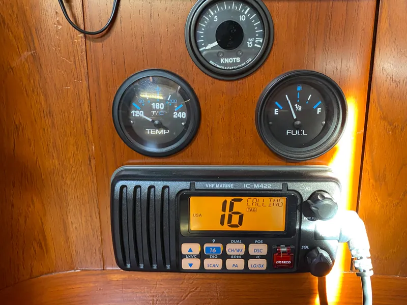 Slide: The Image of Vintage Nautor Swan 44 yacht dashboard with gauges and VHF marine radio. - 46