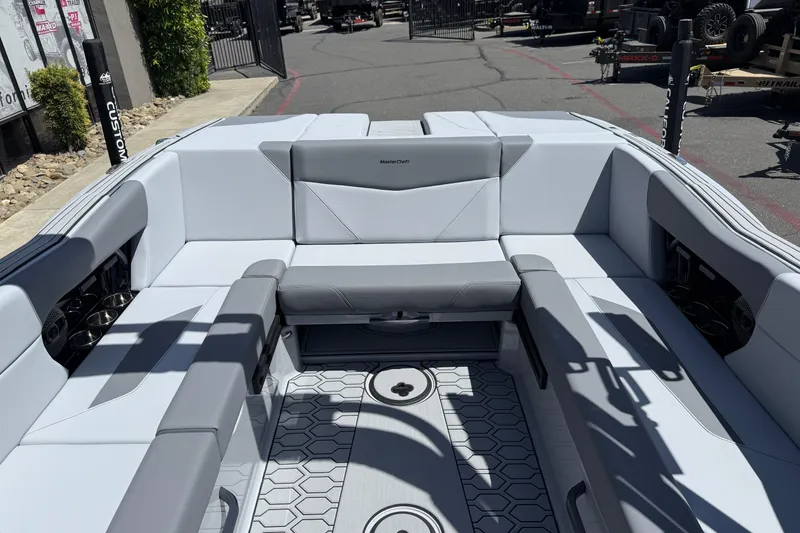 Slide: The Image of 2025 MasterCraft NXT24 boat interior with sleek seating and modern design. - 30