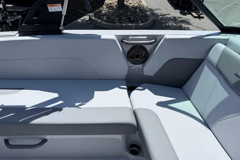 Slide: The Image of Interior seating of 2025 MasterCraft NXT24 boat with speaker and cup holders. - 33