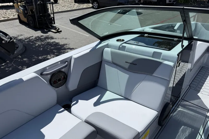 Slide: The Image of 2025 MasterCraft NXT24 boat interior with sleek seating and modern design. - 34