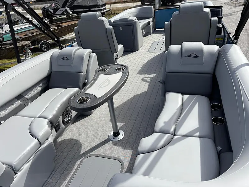 Slide: The Image of Luxurious interior of 2025 SunCatcher Fusion 324RC pontoon boat with plush seating. - 10
