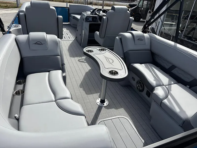 Slide: The Image of Luxurious interior of 2025 SunCatcher Fusion 324RC pontoon boat with plush seating and table. - 11