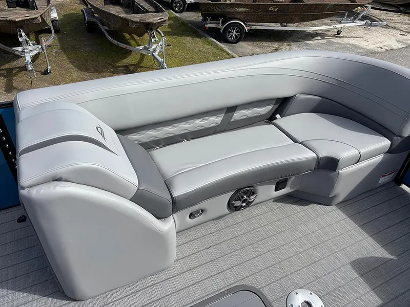 Slide: The Image of 2025 SunCatcher Fusion 324RC boat interior with sleek gray seating and modern design. - 12