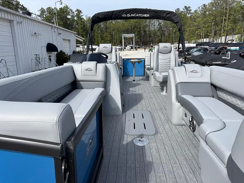 Slide: The Image of 2025 SunCatcher Fusion 324RC pontoon boat with spacious seating and modern design. - 9