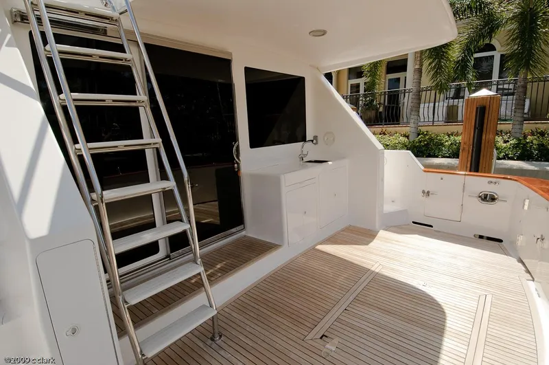 Slide: The Image of 2005 Ocean Alexander 58 Motoryacht deck with ladder and outdoor sink. - 10