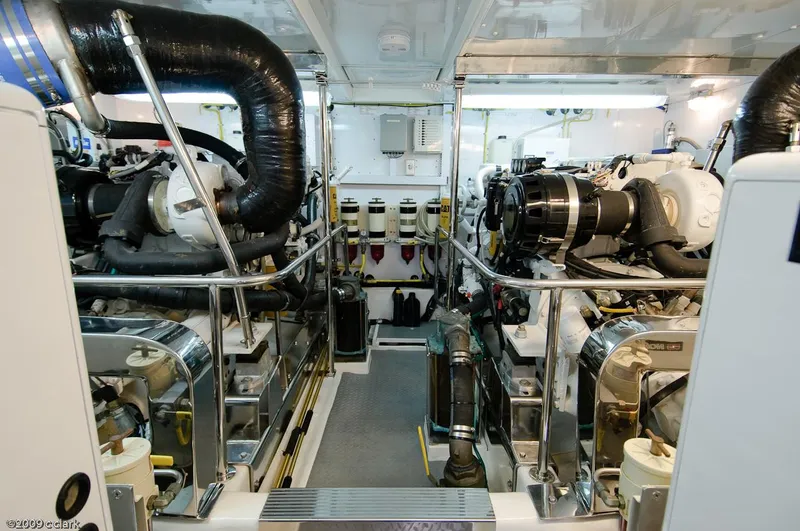 Slide: The Image of Engine room of 2005 Ocean Alexander 58 Motoryacht, showcasing dual engines and mechanical systems. - 18