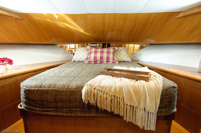 Slide: The Image of Luxurious bedroom in 2005 Ocean Alexander 58 Motoryacht with cozy bedding and elegant wood finish. - 6
