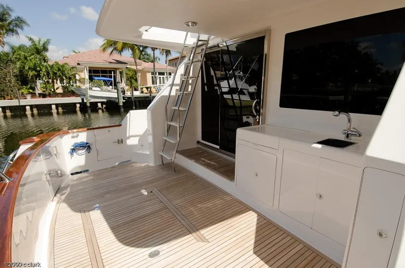 Slide: The Image of 2005 Ocean Alexander 58 Motoryacht deck with ladder, sink, and waterfront view. - 8