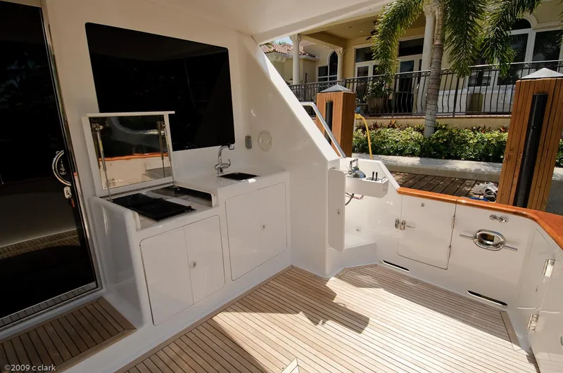Slide: The Image of 2005 Ocean Alexander 58 Motoryacht deck with outdoor kitchen and teak flooring. - 9