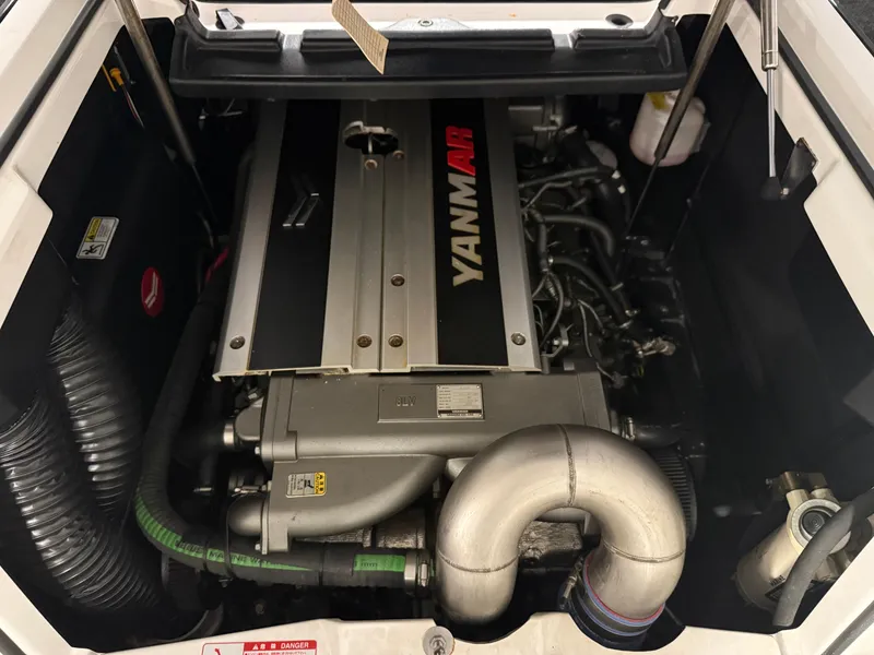 Slide: The Image of 2020 Nautique Super Air G23 engine compartment with Yanmar engine visible. - 14