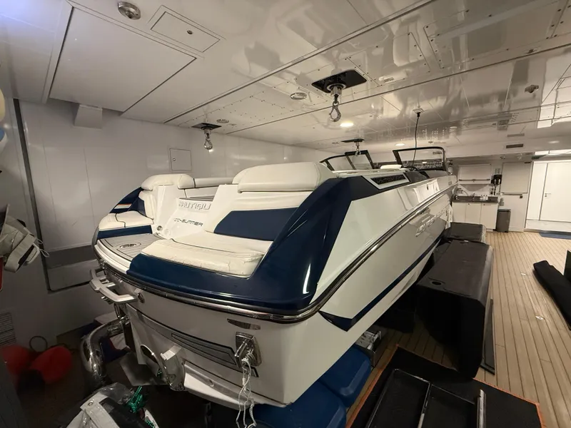 Slide: The Image of 2020 Nautique Super Air G23 boat in indoor storage, showcasing sleek design and luxury features. - 3