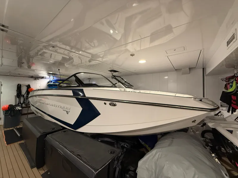 Slide: The Image of 2020 Nautique Super Air G23 boat stored indoors, showcasing sleek design and modern features. - 4
