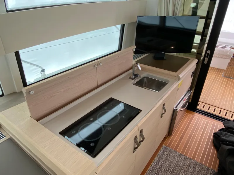 Slide: The Image of Modern kitchen area in 2020 Beneteau Gran Turismo 50 Sportfly yacht with stove and sink. - 10
