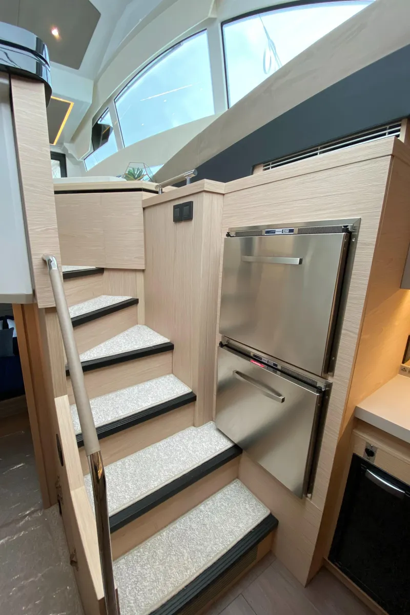 Slide: The Image of Interior staircase of 2020 Beneteau Gran Turismo 50 Sportfly yacht with modern design. - 12