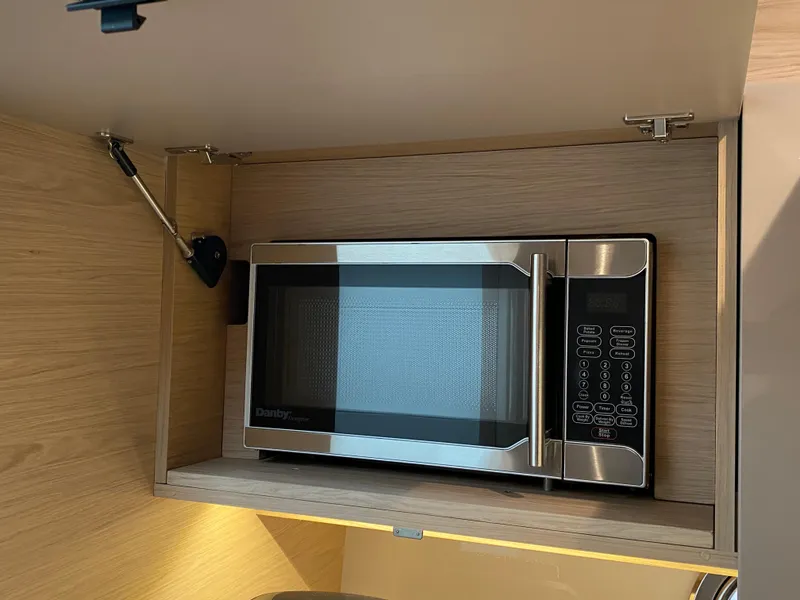Slide: The Image of Microwave in Beneteau Gran Turismo 50 Sportfly yacht kitchen, 2020 model. - 23