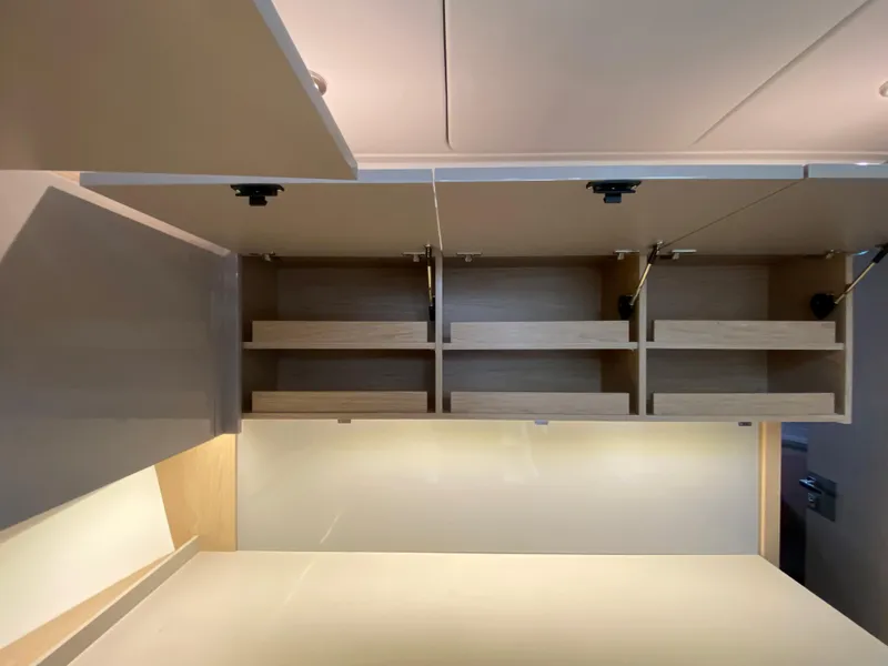 Slide: The Image of Interior storage cabinets in a 2020 Beneteau Gran Turismo 50 Sportfly yacht. - 24