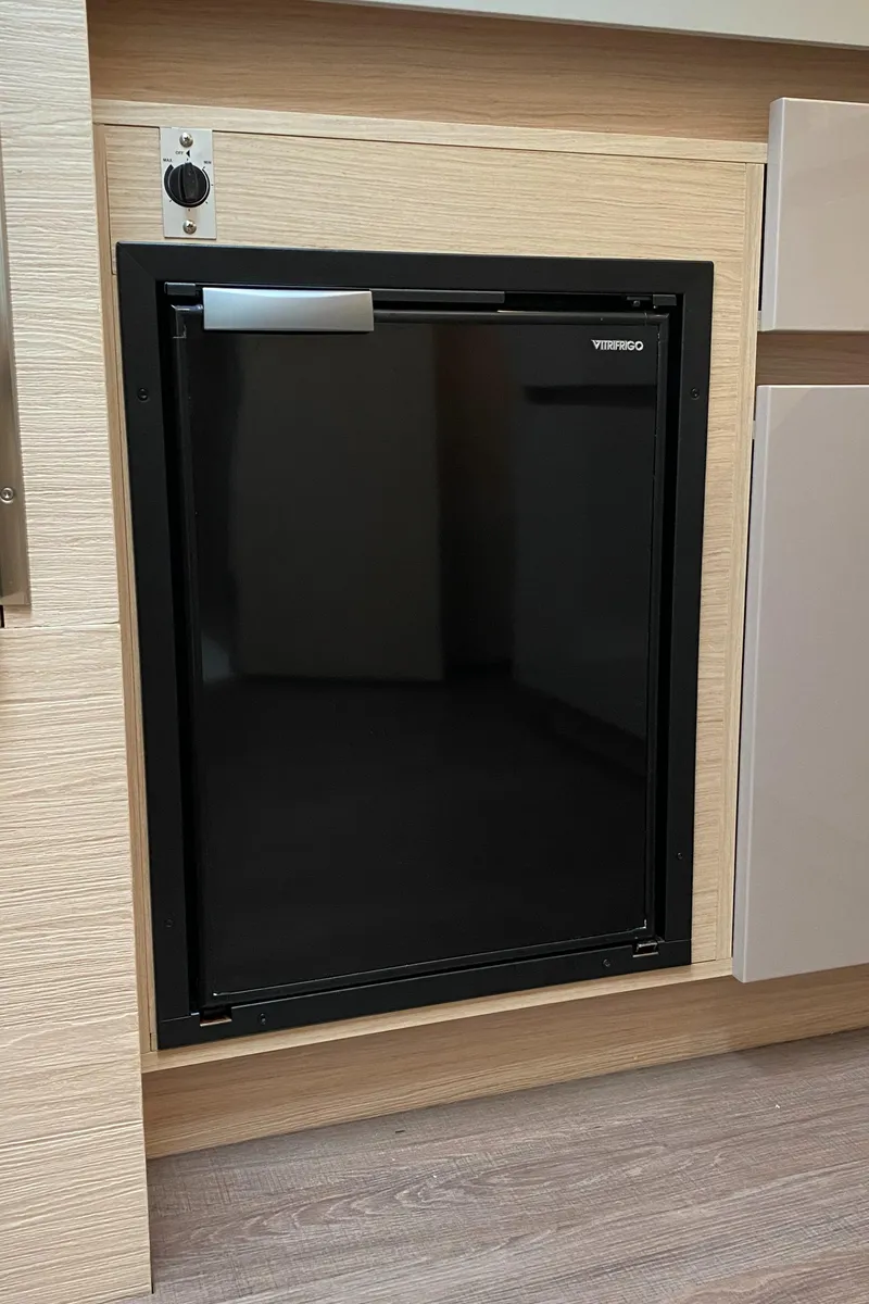 Slide: The Image of Built-in fridge on 2020 Beneteau Gran Turismo 50 Sportfly yacht interior. - 25