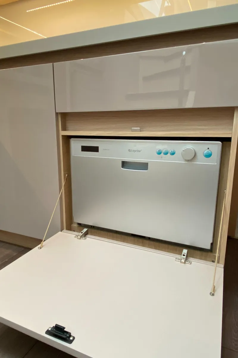 Slide: The Image of Compact dishwasher in a modern kitchen on a 2020 Beneteau Gran Turismo 50 Sportfly yacht. - 26