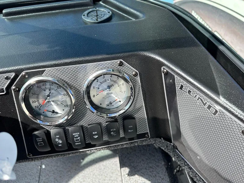 Slide: The Image of Dashboard of 2025 Lund 1650 Rebel XL Sport boat with gauges and controls. - 16