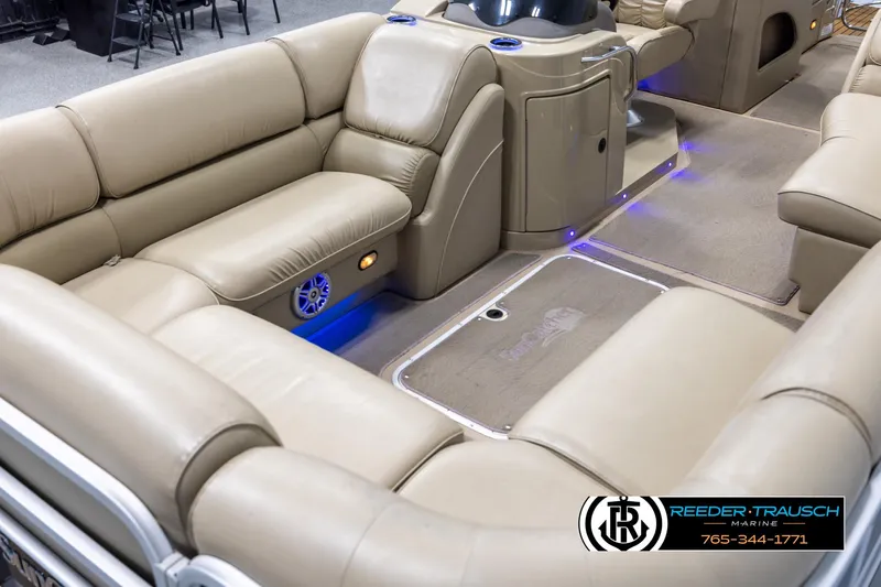 Slide: The Image of Luxurious interior of 2014 SunCatcher Elite 324 pontoon boat with beige seating. - 10