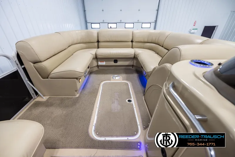 Slide: The Image of Interior of a 2014 SunCatcher Elite 324 pontoon boat with beige seating. - 18