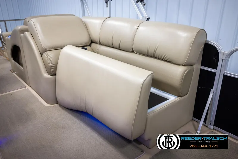 Slide: The Image of 2014 SunCatcher Elite 324 boat seating with beige upholstery and storage compartment. - 22