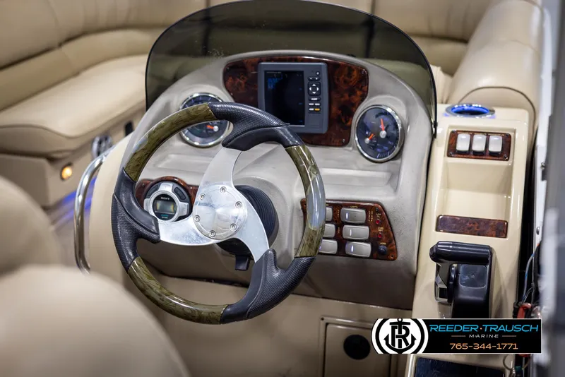 Slide: The Image of Steering console of 2014 SunCatcher Elite 324 boat with modern controls and dashboard. - 25