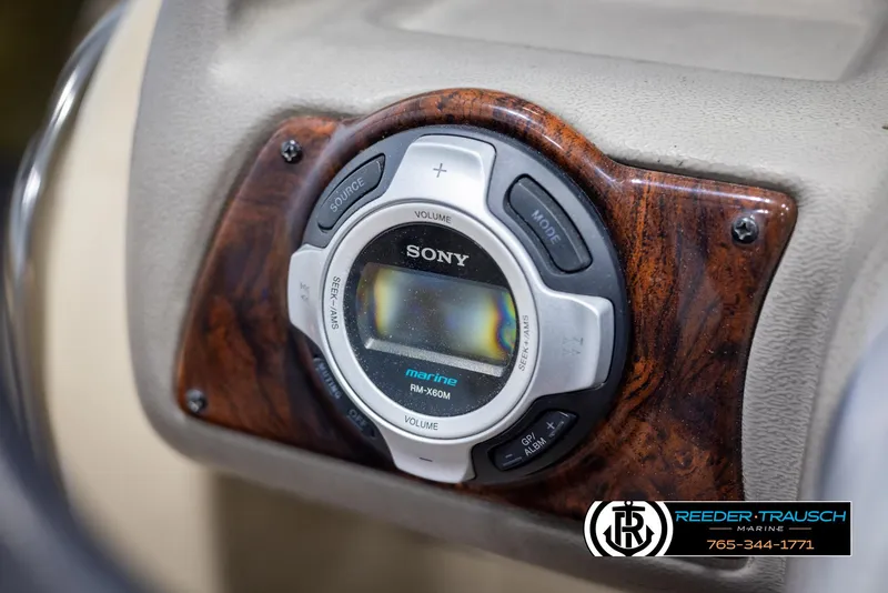 Slide: The Image of Sony marine stereo system on 2014 SunCatcher Elite 324 boat dashboard. - 27