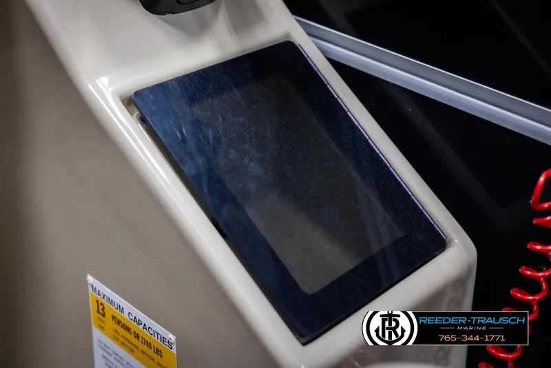 Slide: The Image of Control panel of a 2014 SunCatcher Elite 324 boat with a digital display. - 34