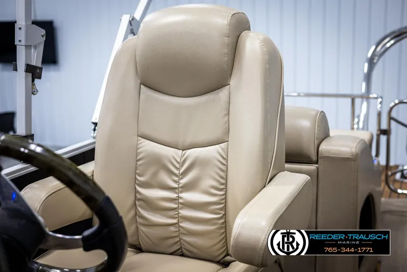 Slide: The Image of Luxurious beige captain's chair in 2014 SunCatcher Elite 324 boat interior. - 36